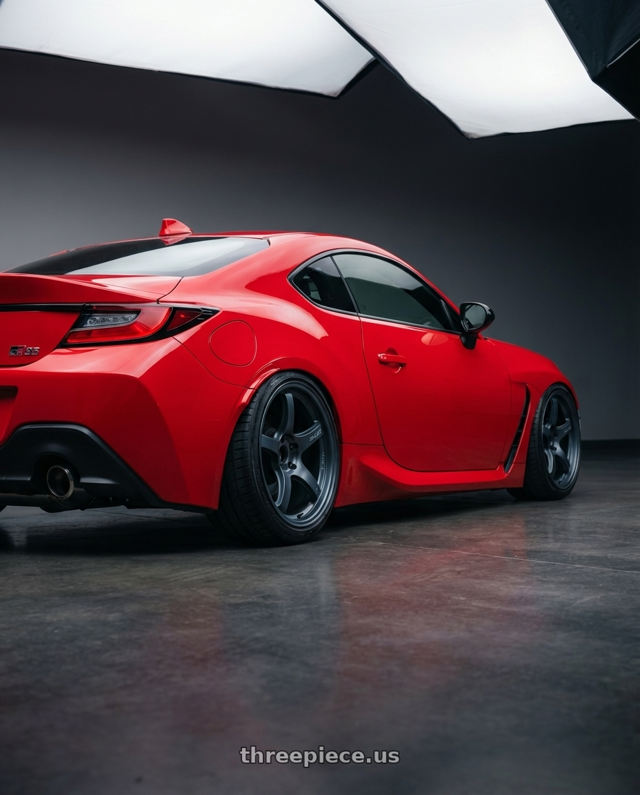 2024 Toyota GR86 with Gram Lights 57CR 5x114.3 18x10.5+12 Gunblue II wheels rear three quarter view slight stretch tires