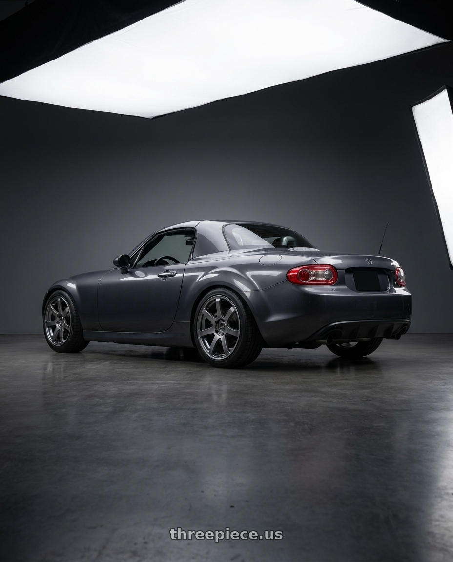 2014 Mazda Miata with Enkei PF07 4x100 17x7.5+42 Dark Silver wheels rear three quarter view square tires