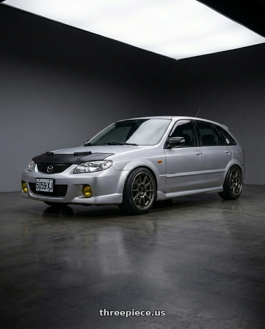 Mazda 323 2000 with WedsSport TC105X 4x100 15x8.0+35 EJ Titan wheels