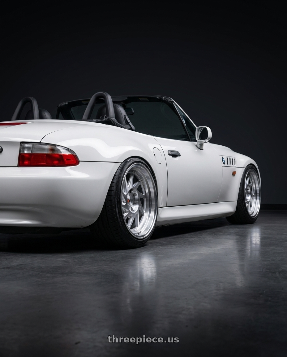 1997 BMW Z3 Roadster with F1R F07 4x100/5x114.3 16x8 +25 Machine Silver wheels rear three quarter view slight stretch tires