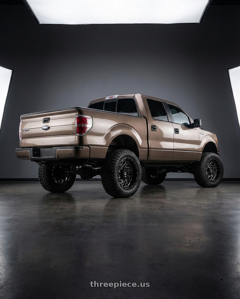 2013 Ford F-150 with Gear Off Road 769BM 6X135/6x139.7 22x10 -19 Gloss Black Milled wheels rear three quarter view meaty tires