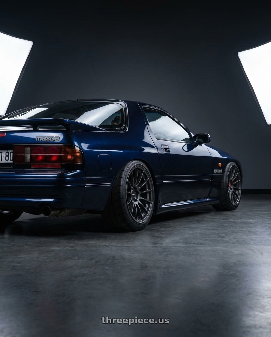 1990 Mazda RX7 with Enkei RS05-RR 5x114.3 18x10.5+15 Matte Gunmetal wheels rear three quarter view meaty tires