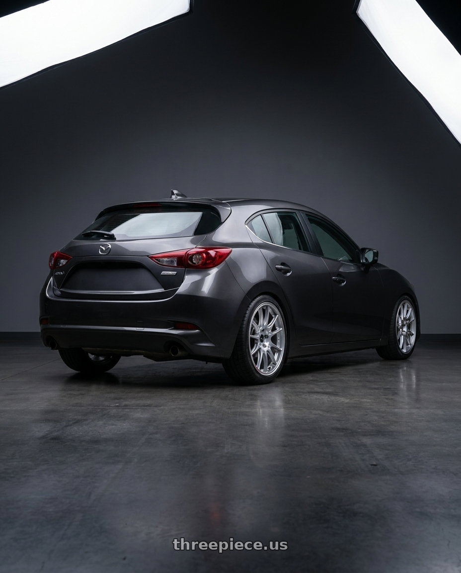 2017 Mazda Mazda3 Hatchback Grand with Enkei GTC02 5x114.3 18x8+45 Hyper Silver wheels rear three quarter view square tires