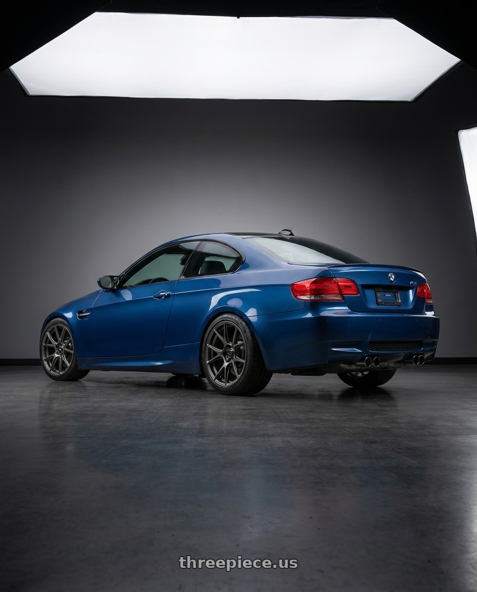 2008 Bmw M3 with Konig Ampliform 5x112 18x8.5+43 Dark Metallic Graphite wheels rear three quarter view square tires