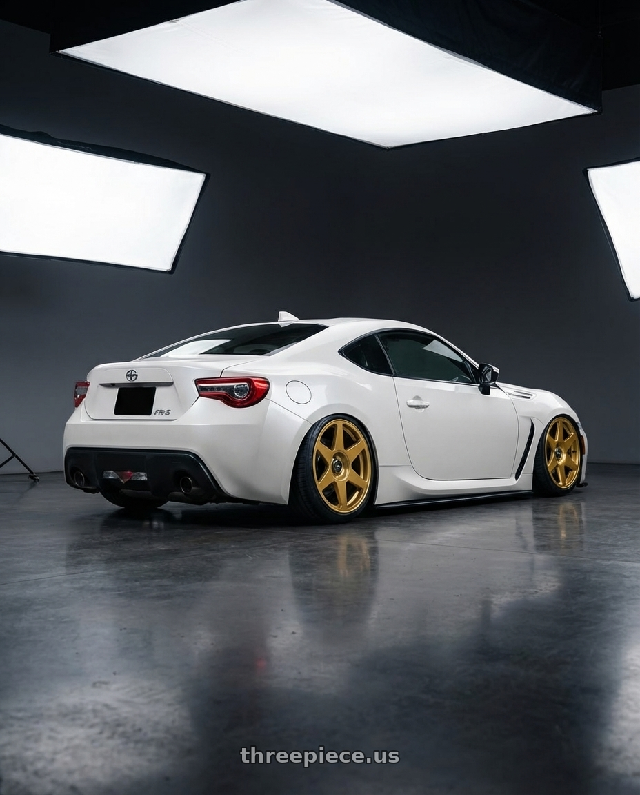 2016 Scion FR-S with fifteen52 TARMAC EVO 5x100 / 5x114.3 18x8.5 +35 GOLD (GLOSS GOLD) wheels rear three quarter view slight stretch tires