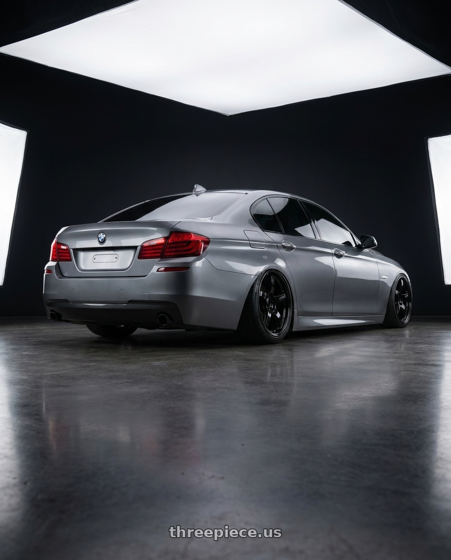 2016 BMW 5 Series F10 with Gram Lights 57CR 5x120 19x10.5+35 Glossy Black wheels rear three quarter view slight stretch tires