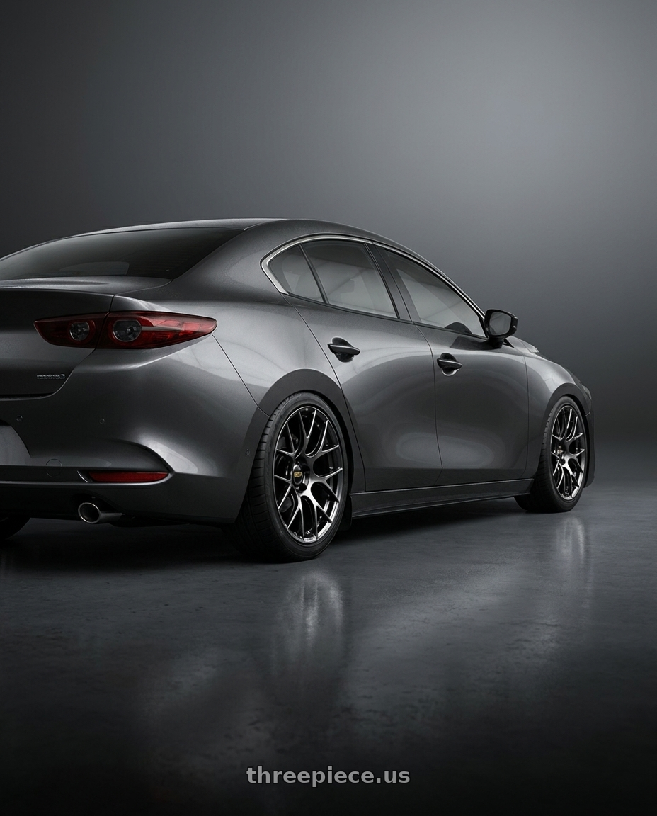 2024 Mazda3 Sedan with BBS RE-V7 5x112 19x9.5 +25 Diamond Black wheels rear three quarter view slight stretch tires