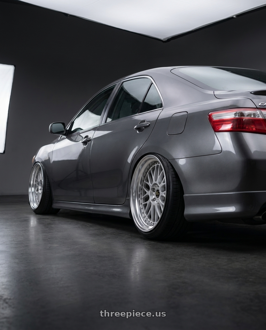 2007 Toyota Camry with Work Vs-Xx 5x114.3 20x14-33 T Disk Light Grey Silver wheels rear three quarter view extreme stretch tires