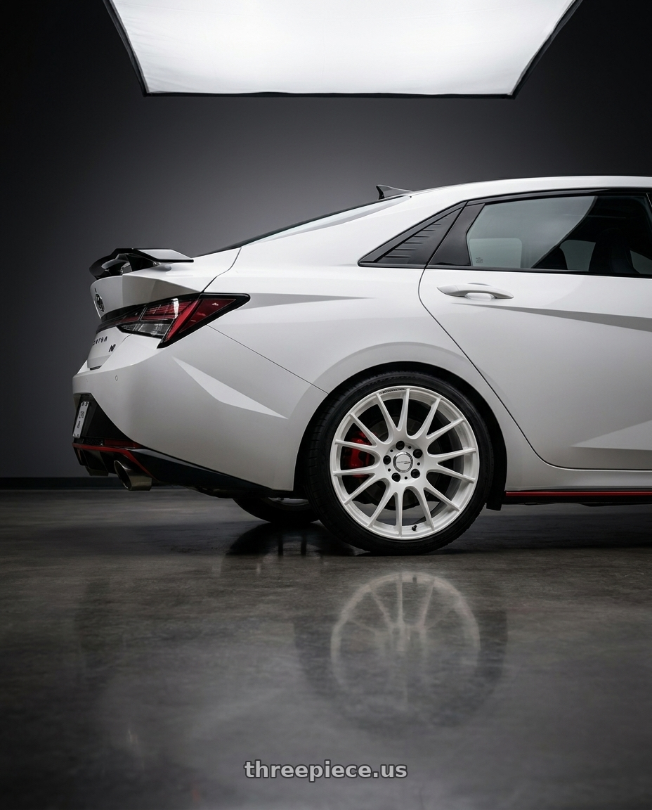 2026 Hyundai Elantra with Work Emotion m8r 5x114.3 19x8.5 +45 White wheels rear three quarter view square tires