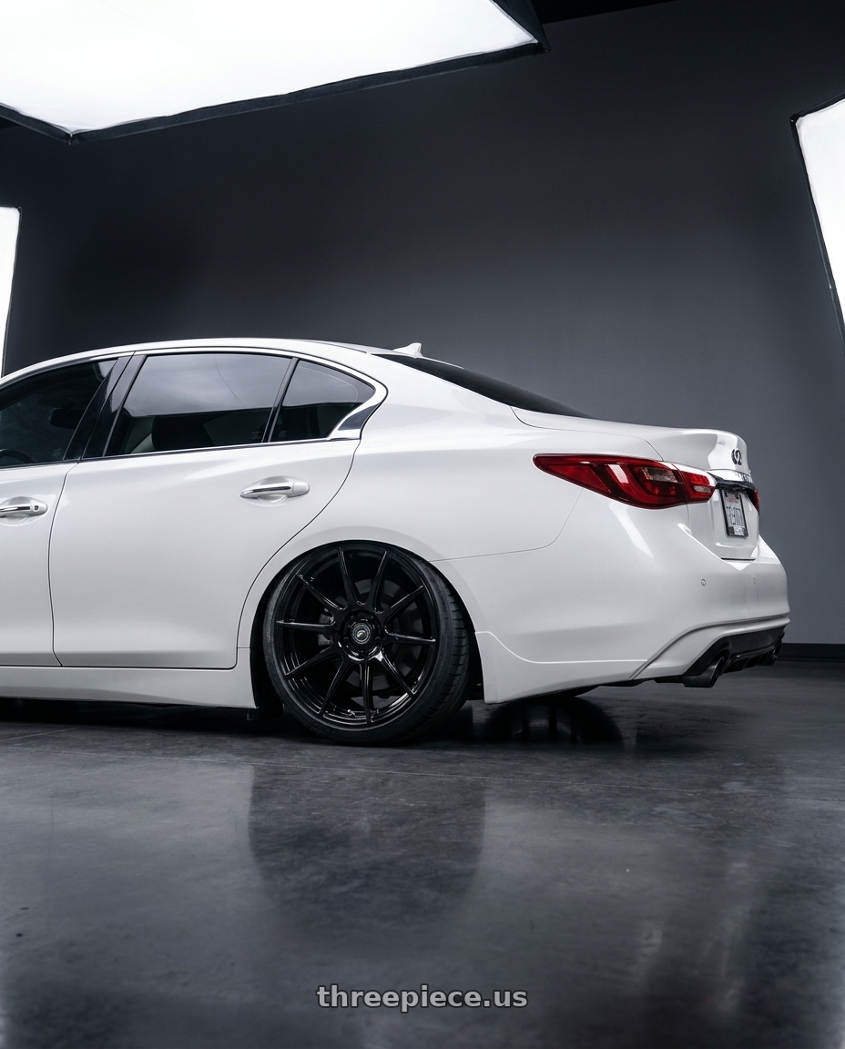 2020 Infiniti Q50 with Forgestar CF10 5x114.3 19x9.5 +29 Gloss Black wheels rear three quarter view slight stretch tires