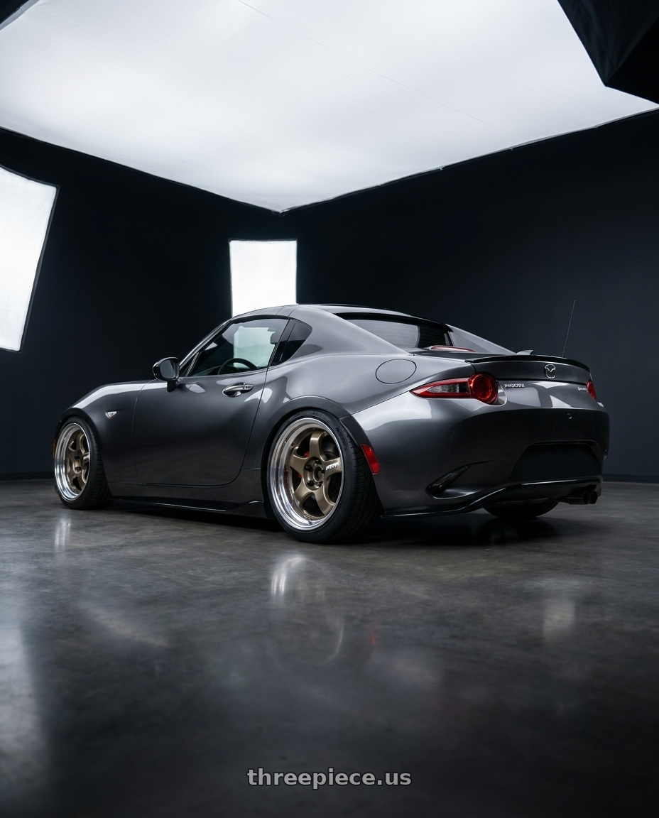 2021 Mazda Miata with Work Meister S1 2P 4x100 15x9+45 O Disk Titanium Gold wheels rear three quarter view slight stretch tires