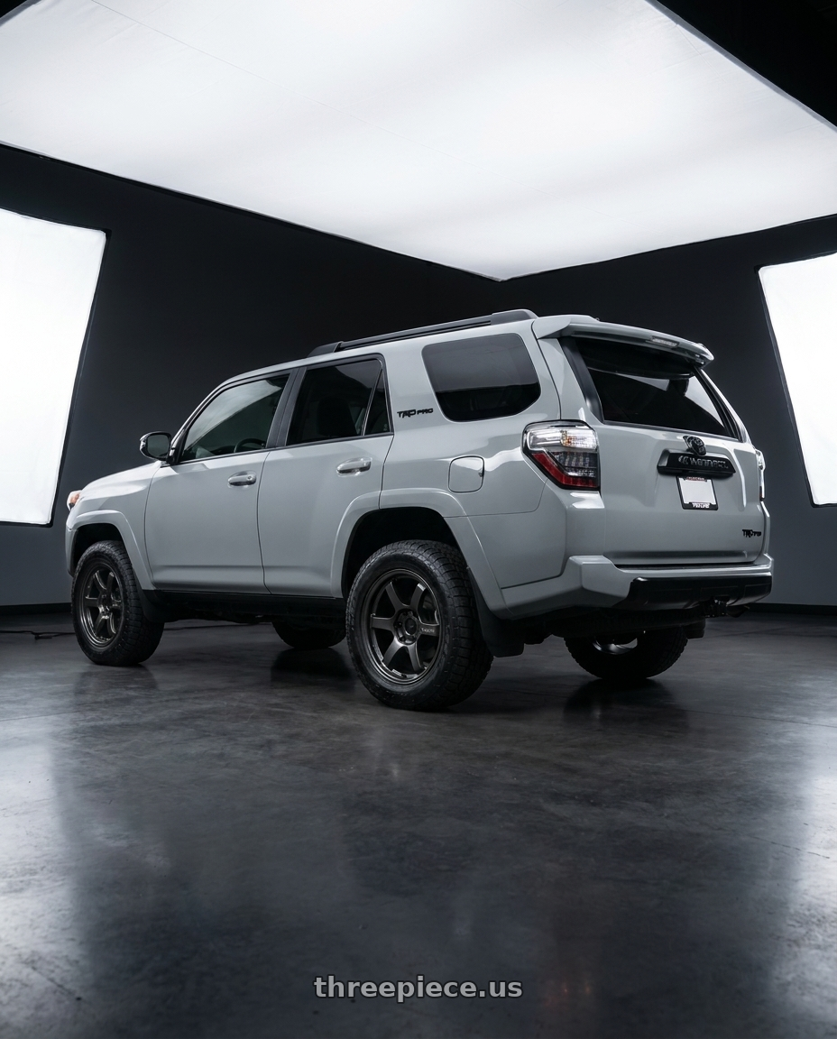 2017 TOYOTA 4RUNNER TRD Pro Cement with Gram Lights 57DR-X 6x139.7 17x8.5+0 Super Dark Gunmetal AXZ wheels rear three quarter view slight stretch tires