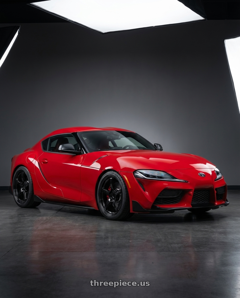 2023 Toyota GR Supra with Gram Lights 57CR 5x112 19x8.5+45 Glossy Black wheels front three quarter view lowered stance
