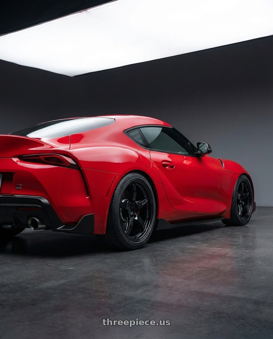 2023 Toyota GR Supra with Gram Lights 57CR 5x112 19x8.5+45 Glossy Black wheels rear three quarter view square tires