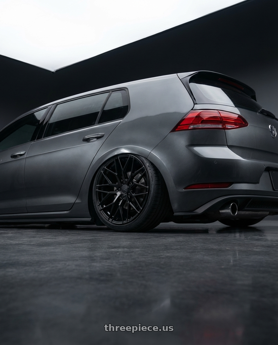 2019 Volkswagen GTI MK7 with Avant Garde Wheels M520R 5X112 19x9.5 +40 Gloss Black wheels rear three quarter view slight stretch tires