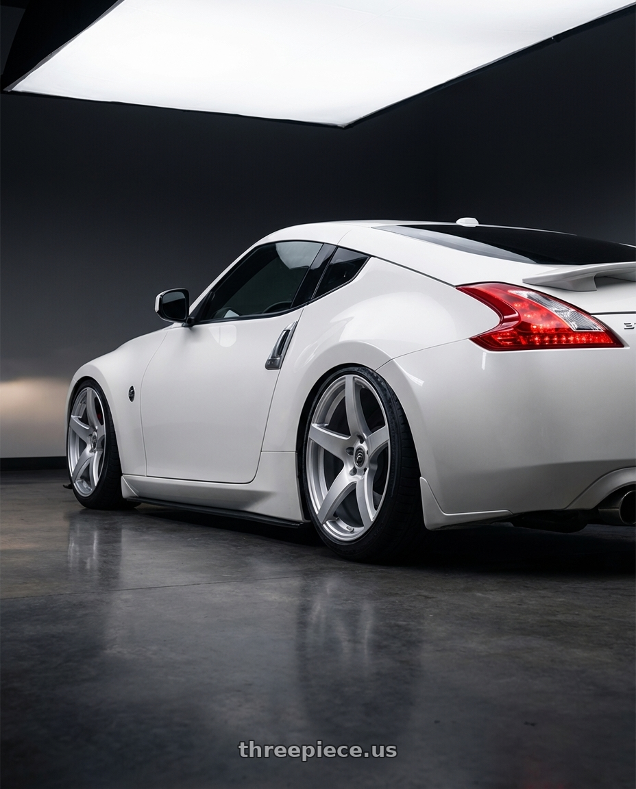 2019 Nissan 370Z with Forgestar CF5 5x114.3 19x10 +42 Gloss Silver wheels rear three quarter view slight stretch tires