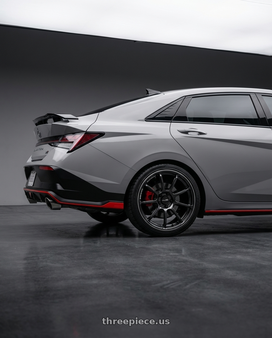 2024 Hyundai Elantra N Cyber Grey Facelift with Advan Racing RSIII 5x114.3 18x8.5 +45 BLACK GUNMETALLIC & RING wheels rear three quarter view square tires
