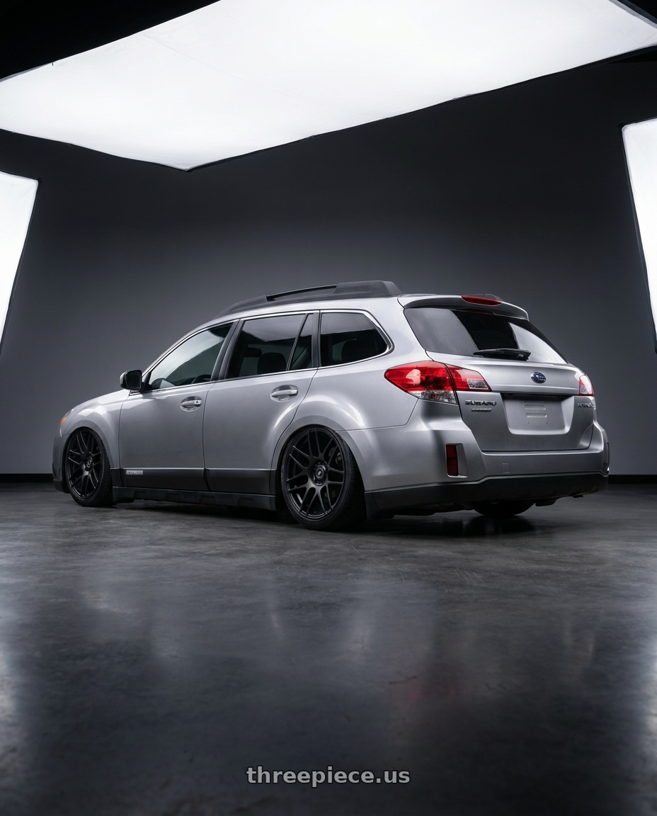 2012 Subaru Outback with Forgestar F14C 5x100 18x8.5 +38 Satin Black wheels rear three quarter view slight stretch tires