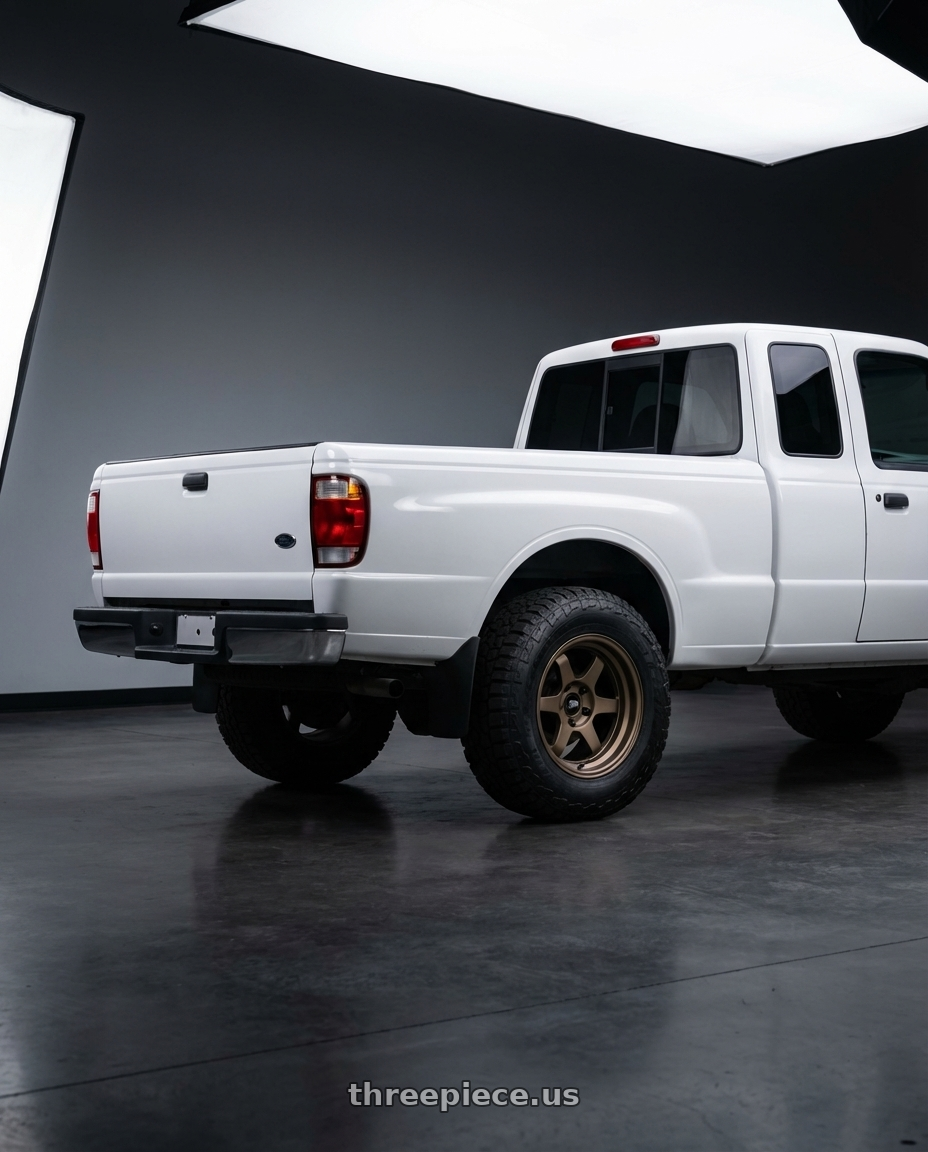 1996 Mazda B2300 with MST Wheels Time Attack 5x100 15x7.0 +20 Matte Bronze wheels rear three quarter view meaty tires