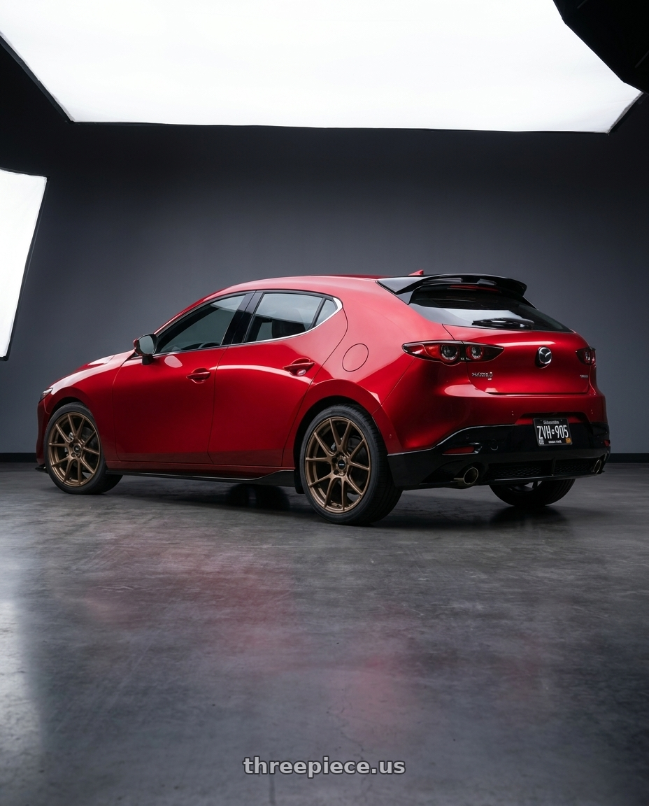 2026 Mazda 3 hatchback soul red with Enkei TS-V 5x114.3 18x8.5+38 Bronze wheels rear three quarter view square tires