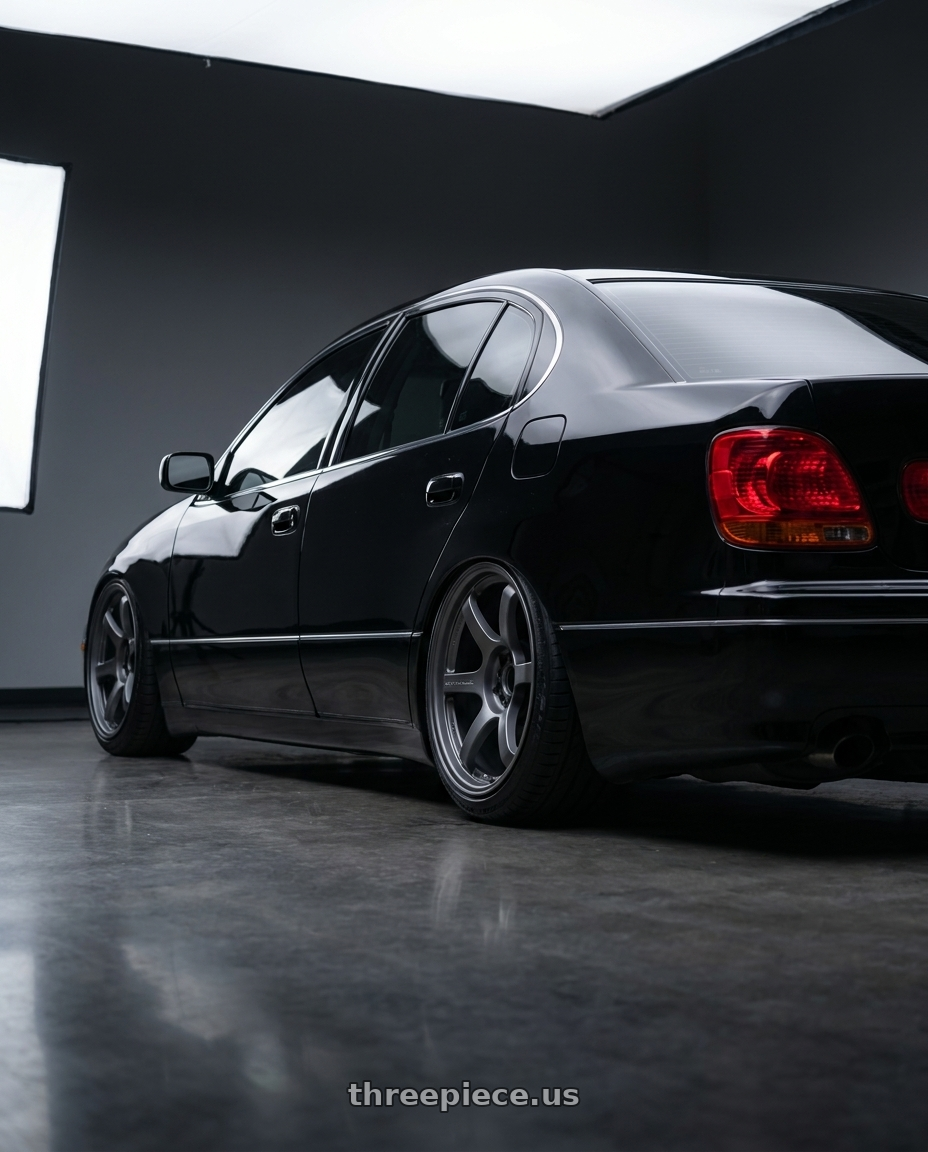 2004 Lexus gs300 with Gram Lights 57DR 5x114.3 18x9.5+12 Gunblue II wheels rear three quarter view slight stretch tires