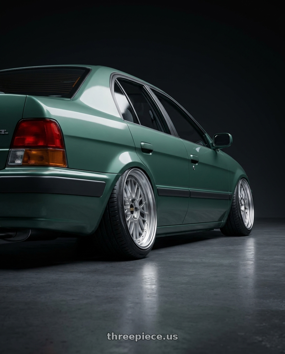 1998 TOYOTA Tercel with BBS LM 5x114.3 18x8.0+40 Diamond Silver wheels rear three quarter view slight stretch tires