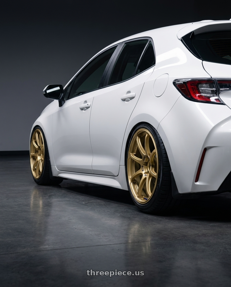 2023 Toyota Corolla Hatchback with Advan RCIII 5x114.3 18x7.5+45 Gold wheels rear three quarter view slight stretch tires