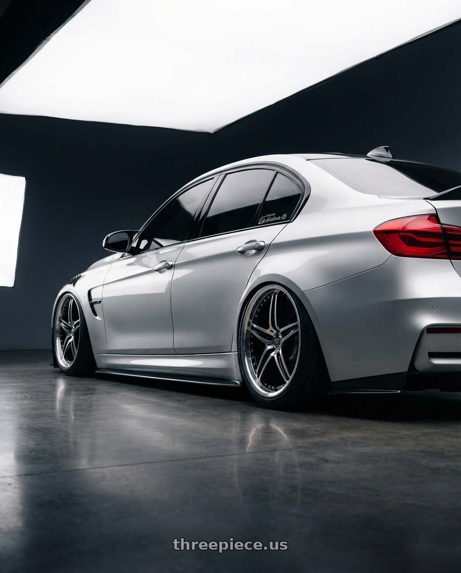 2022 BMW G80 with Motegi MR107 D5S 5X110 16X7 +45 GLOSS BLACK MACHINED wheels rear three quarter view extreme stretch tires