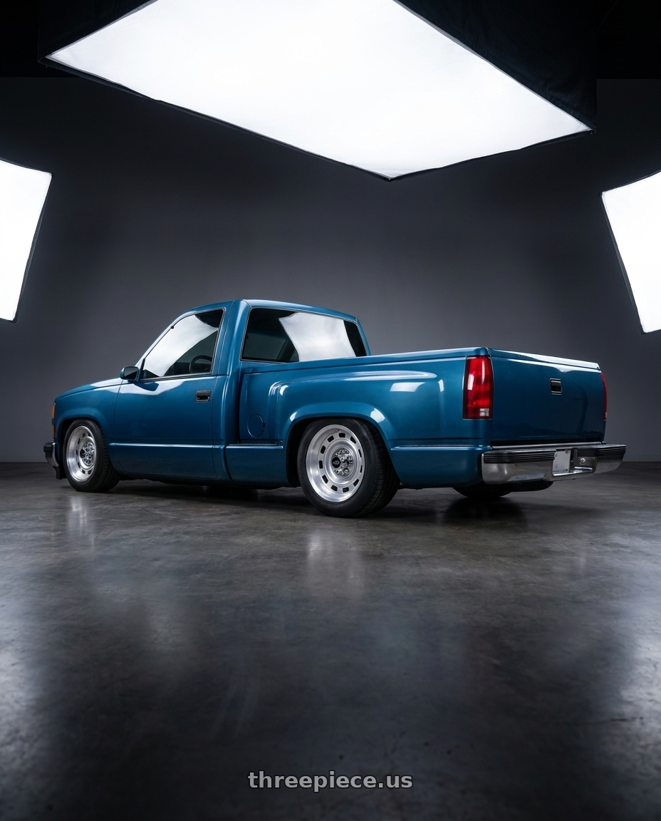 1990 Chevy Silverado blue with Vision American Muscle 54 Cheyenne 6x139.7 22x9+25 wheels rear three quarter view square tires