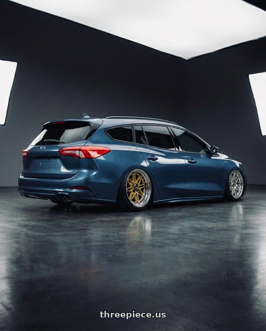 2023 focus wagon  with WORK Equip 03 4x100 15x11 -31 GOLD wheels rear three quarter view extreme stretch tires