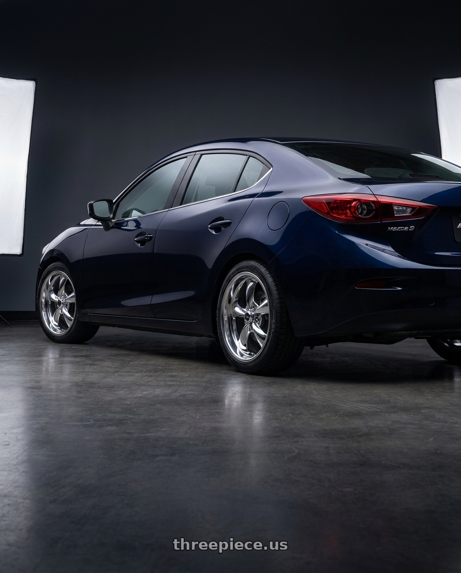 2017 mazda 3 sedan with American Racing AR605 TORQ THRUST M 5X110 17X7.5 +45 CHROME wheels rear three quarter view square tires