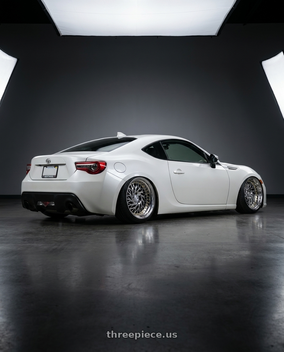 2016 Scion FR-S with Aodhan DS03 5x100 18x9.5 +35 Vacuum Chrome w/Gold Rivets wheels rear three quarter view slight stretch tires