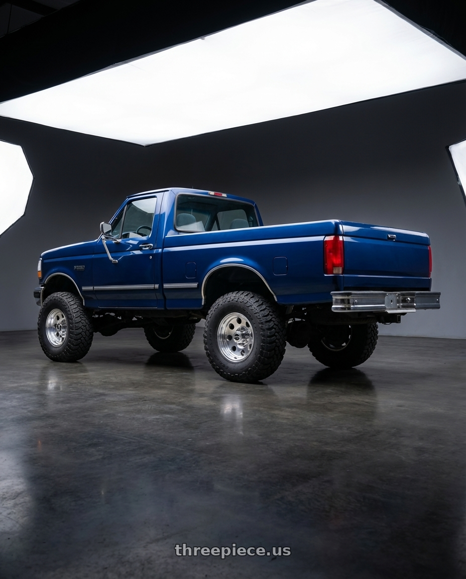 1997 ford f250 xl blue with American Racing AR172 BAJA 5X114.3 15X10 -43 POLISHED wheels rear three quarter view meaty tires