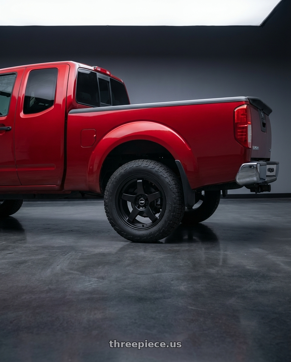 2012 Nissan frontier sv extended cab with Ns Wheels NS-M01 5x114.3 18x8.5 +35 Matte Black wheels rear three quarter view square tires