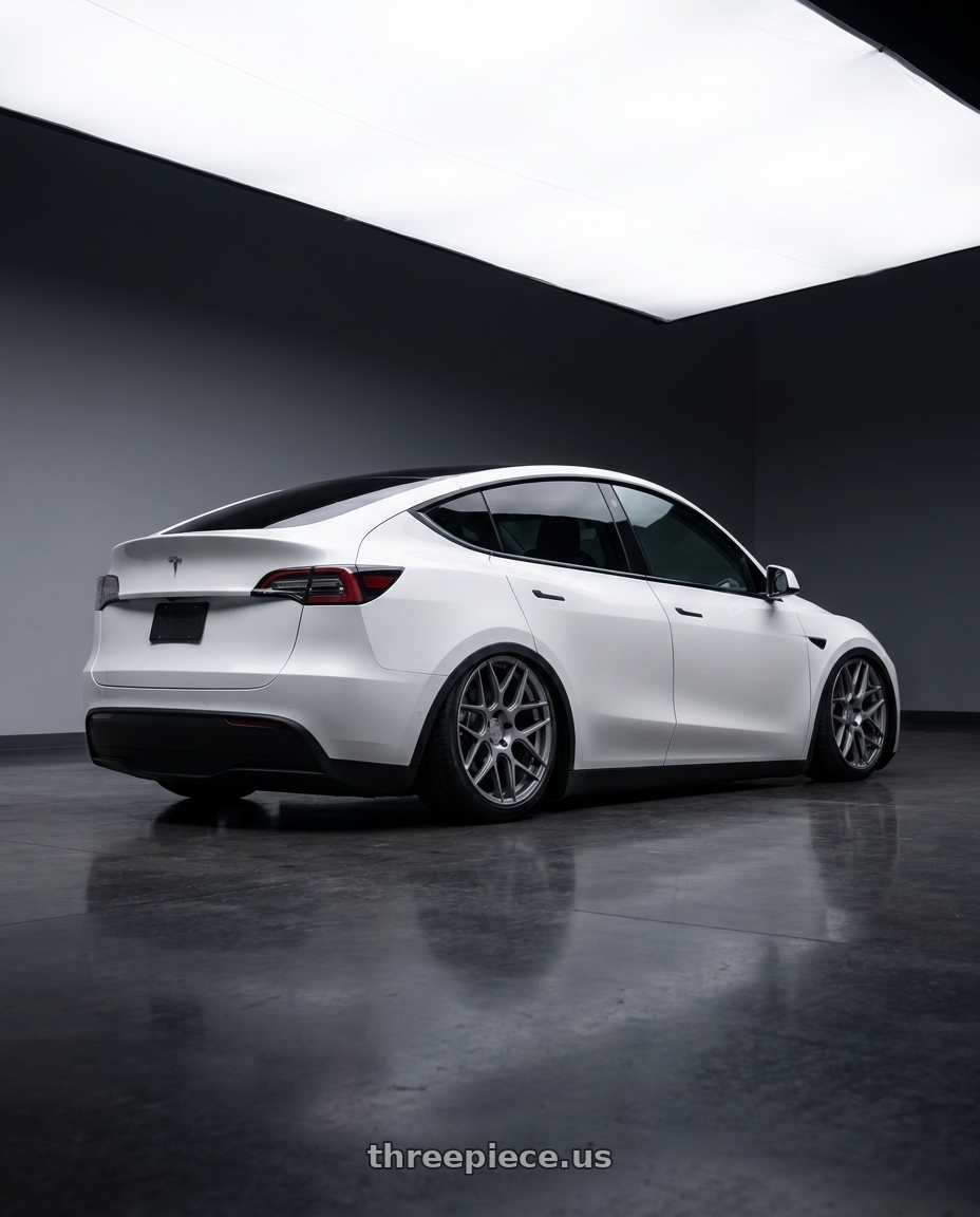 2024 Tesla Model Y with Aodhan AFF2 5x114.3 20x9+32 Matte Gray wheels rear three quarter view slight stretch tires