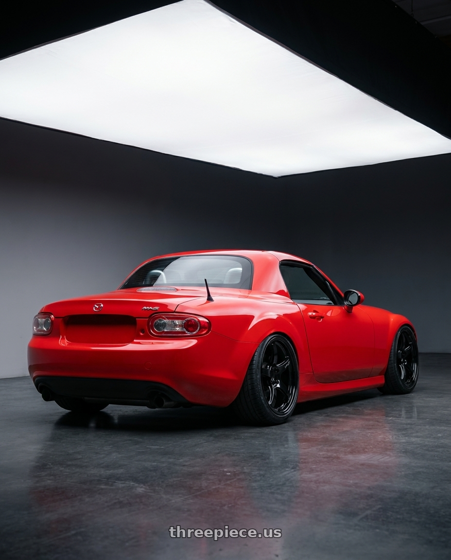 2012 Mazda MX-5 Miata NC with Gram Lights 57CR 5x114.3 17x9+22 Glossy Black wheels rear three quarter view slight stretch tires