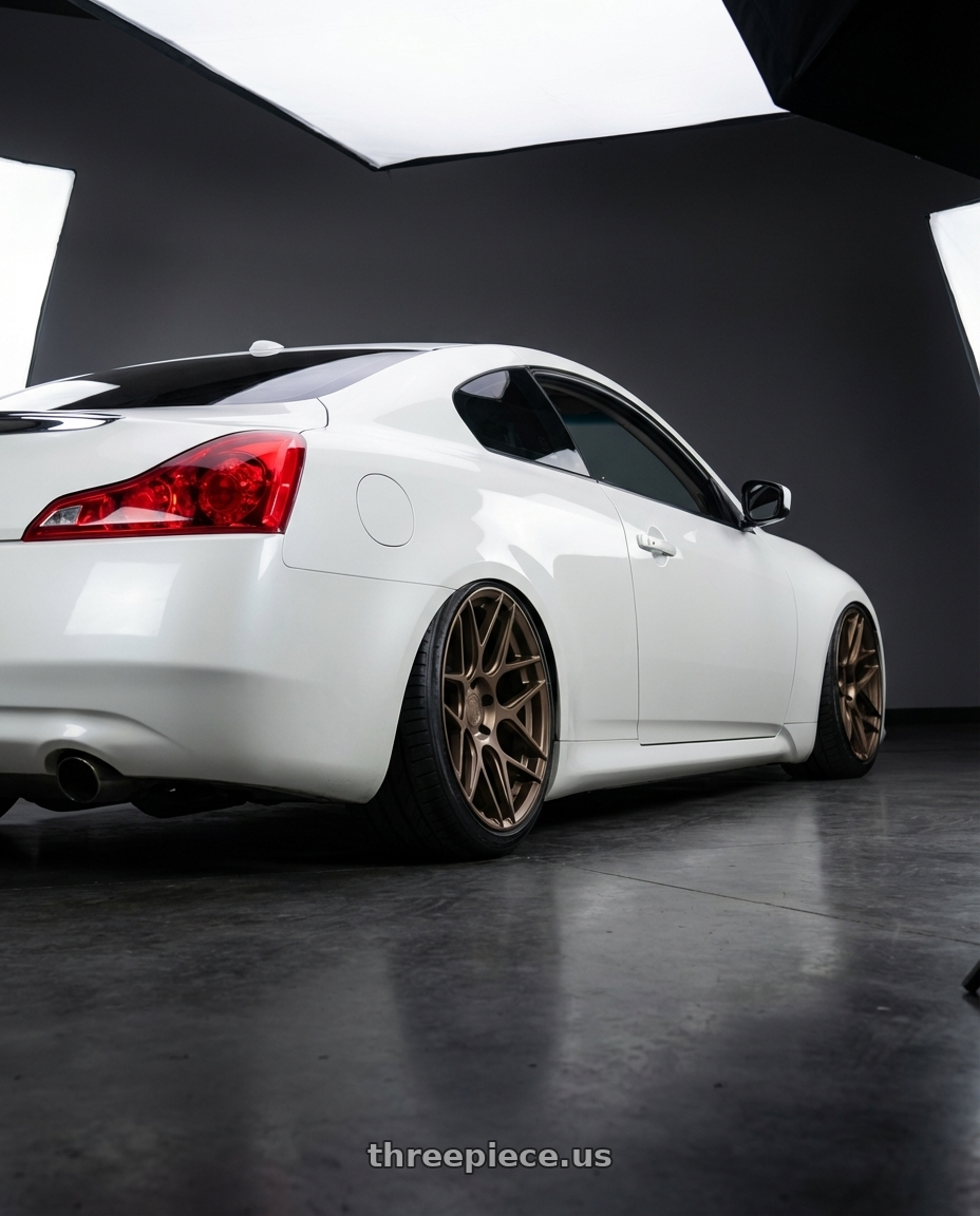 2014 Infiniti G37 Coupe with Aodhan AFF2 5x114.3 19x8.5+35 Matte Bronze wheels rear three quarter view slight stretch tires