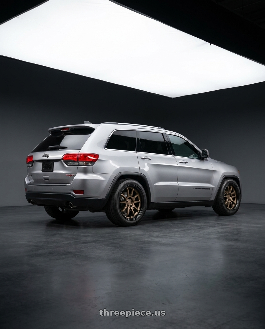 2018 Jeep Grand Cherokee with Project Kics R40 Iconix Black M14x1.50 Lug Nuts wheels rear three quarter view square tires