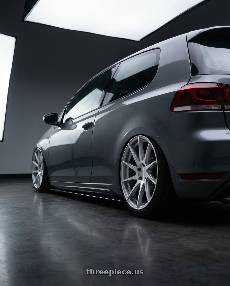 2013 Volkswagen GTI MK6 with Aodhan AH09 5x112 18x8.5 +35 Gloss Silver Machined Face wheels rear three quarter view slight stretch tires