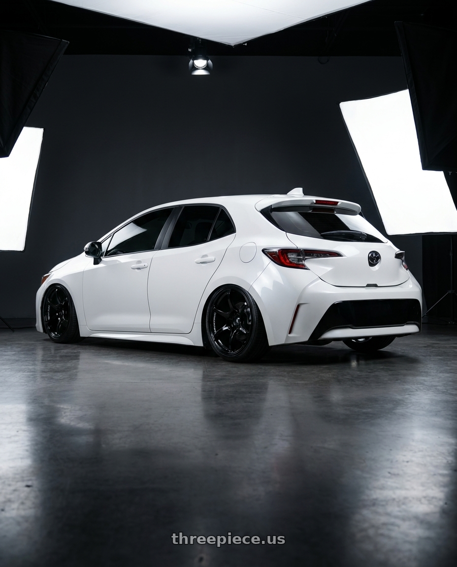 2023 Toyota Corolla Hatchback with Advan RGIII 5x114.3 18x8.0+37 Gloss Black wheels rear three quarter view slight stretch tires