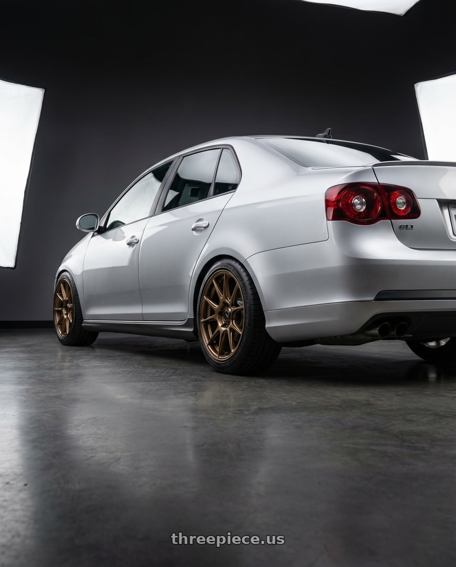 2009 Volkswagen Jetta GLI MK5 with Konig Ampliform 5x112 18x8.5+43 Gloss Bronze wheels rear three quarter view square tires