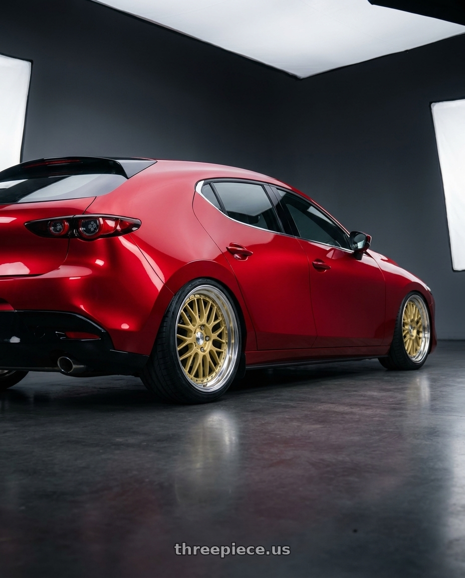 2025 Mazda 3 with Work Lanvec Lm1 5x114.3 18x8.5+45 A Disk Light Metallic Gold wheels rear three quarter view square tires