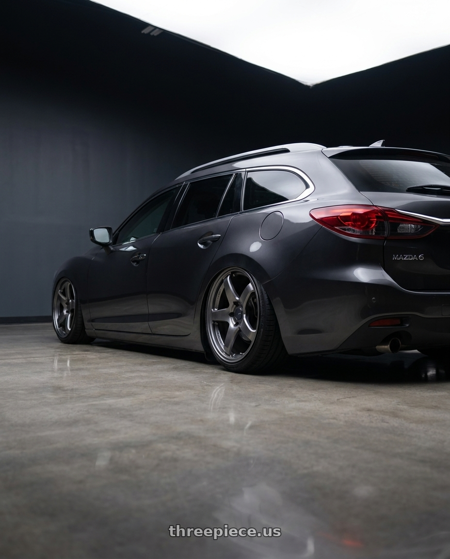 2019 Mazda 6 wagon with Enkei PF05 5x114.3 19x8.5+38 Dark Silver wheels rear three quarter view slight stretch tires