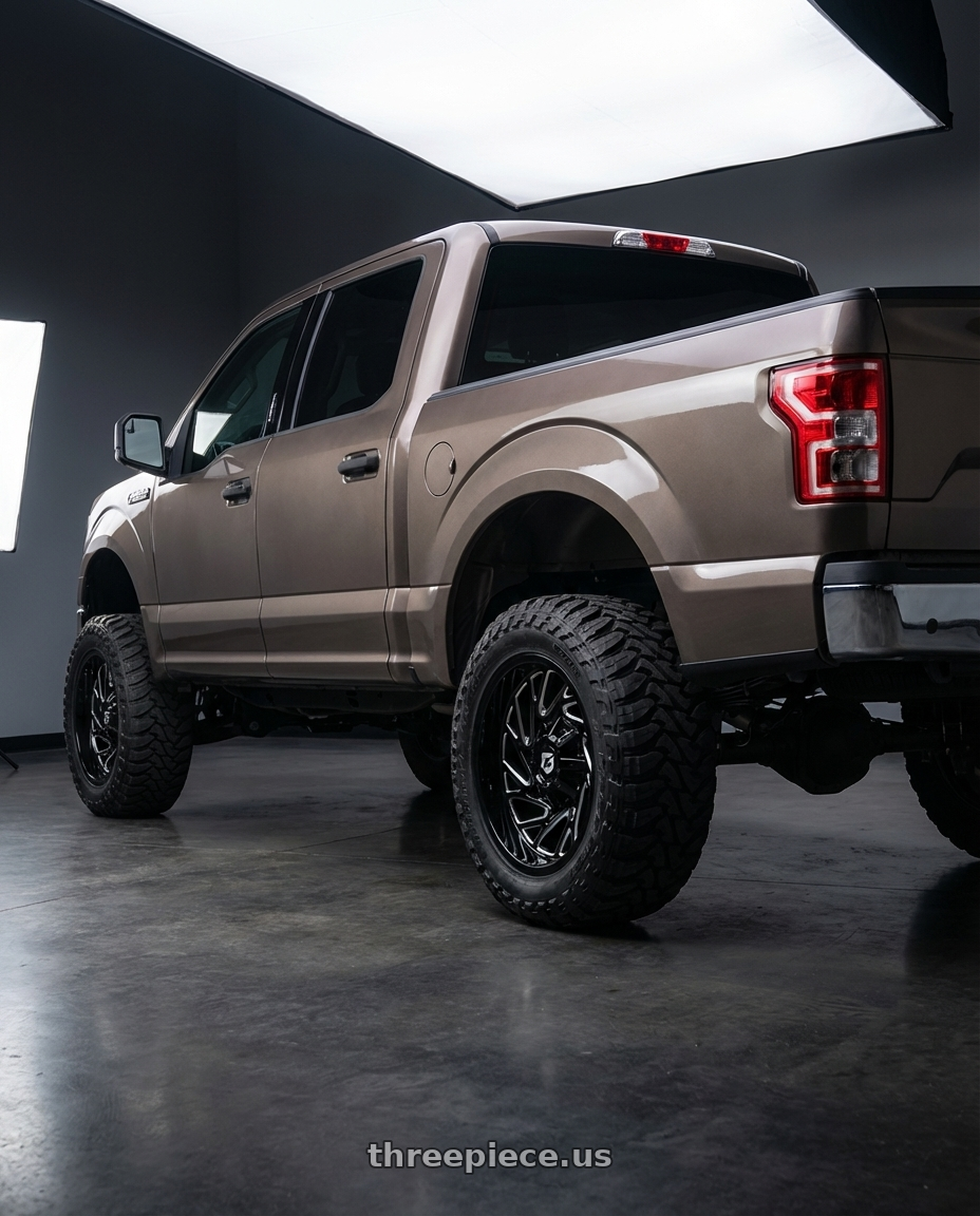 2019 Ford F-150 with Gear Off Road 769BM 6X135/6x139.7 22x10 -19 Gloss Black Milled wheels rear three quarter view meaty tires
