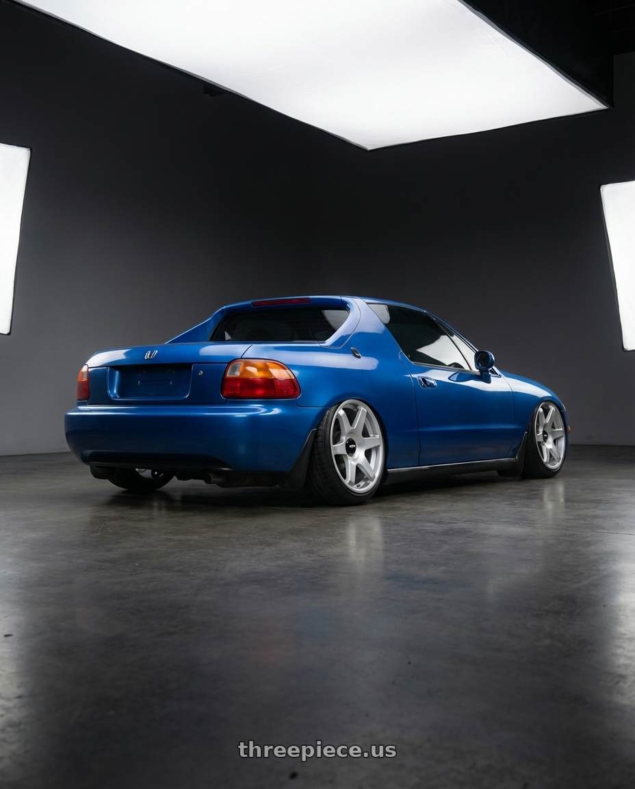 del sol so 1998 with Rotiform 1PC R114 SIX 5X100/5X112 19X8.5 +45 GLOSS SILVER wheels rear three quarter view extreme stretch tires