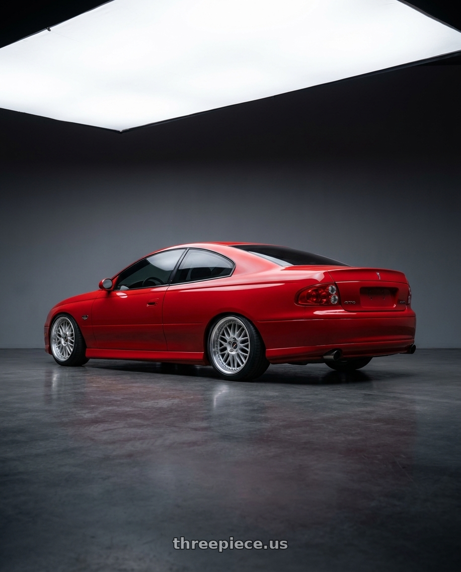 2004 Pontiac gto with Work Vs-Xx 5x120 19x8.5+40 R Disk Light Grey Silver wheels rear three quarter view slight stretch tires