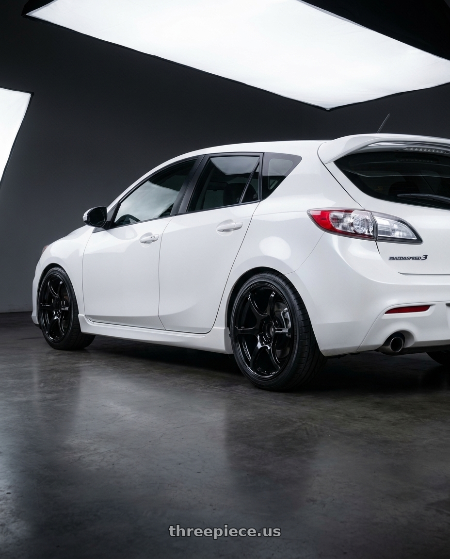 2012 Mazda Mazdaspeed3 with Advan RGIII 5x114.3 18x9.0+35 Gloss Black wheels rear three quarter view square tires