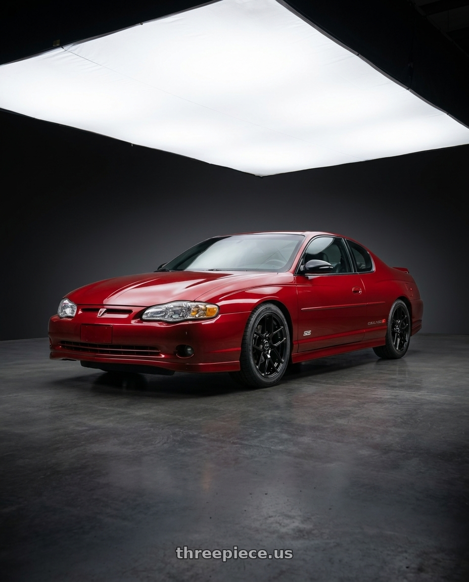 2004 Chevrolet Monte Carlo SS with RTX Envy 5x115 17x7.5 +38 Gloss Black wheels front three quarter view lowered stance