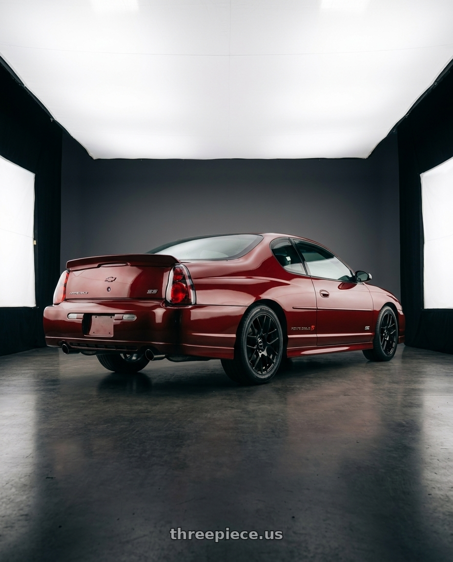2004 Chevrolet Monte Carlo SS with RTX Envy 5x115 17x7.5 +38 Gloss Black wheels rear three quarter view square tires