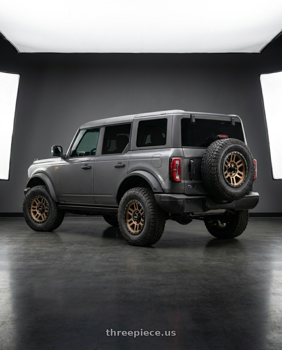 2023 Ford Bronco Badlands with Vision Off-Road 354 Manx 2 6x139.7 17x9+12 Bronze wheels rear three quarter view square tires